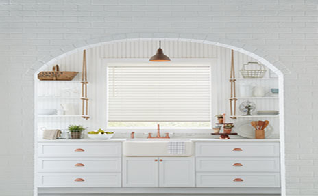 White Window Shade in White Kitchen with Gold Accenting